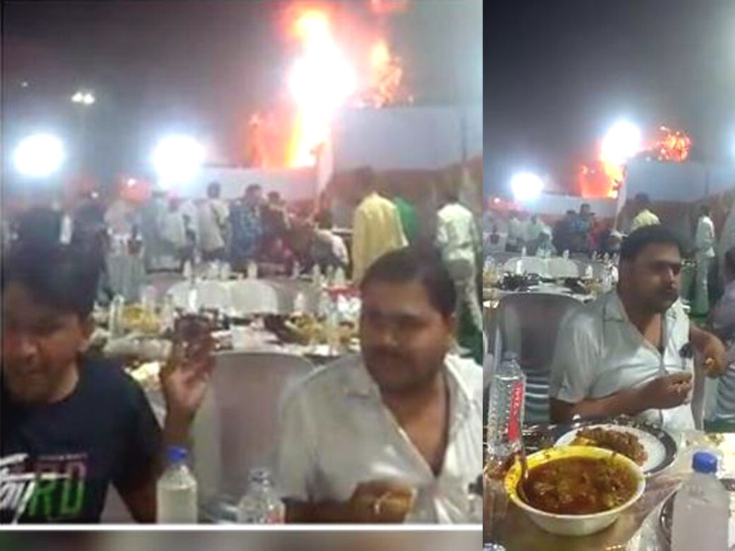 திருமண மண்டபமே தீப்பற்றி எரியும் போது கூலாக சாப்பிடும் 2 விருந்தினர்: இணையத்தில் வைரல்!